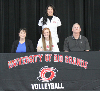 Jackson High's Sarah Martin poses with her parents and Rio coach Billina Donaldson after signing with the RedStorm
